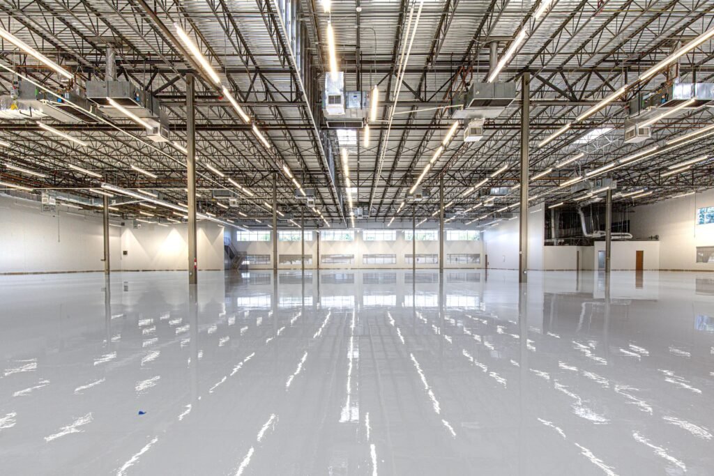 Spacious and polished industrial facility with glossy epoxy flooring in Houston, Texas.